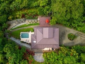 Aerial view of a Mediterranean-inspired villa with pool and lush garden in Dominical.