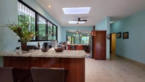 Bright, open living space with large windows and modern decor in Costa Rica.