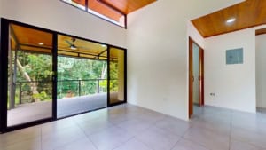 Bright, spacious room with large glass doors and balcony in Dominical.