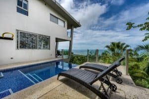 Modern jungle home with pool, ocean view, and tropical surroundings in Dominical.