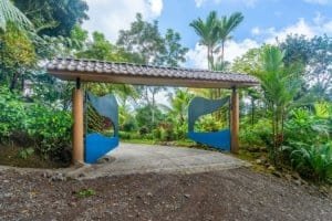 Entrance gate to a lush tropical garden in Dominical, Costa Rica.