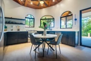Bright kitchen with large windows and tropical views in Dominical.
