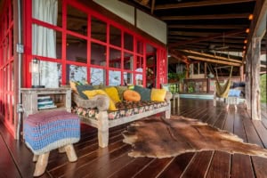 Cozy outdoor living space with colorful cushions and hammock in Dominical.