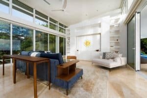 Bright, spacious living room with large windows and ocean views.