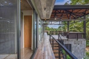 Balcony of a Costa Rican property with lush greenery and modern design features.