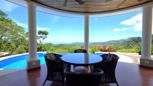 Covered patio with ocean and mountain views in Dominical, Costa Rica.