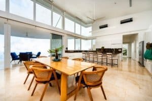 Bright, spacious dining room with ocean views and contemporary decor.