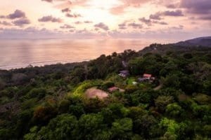 A lush green coastal estate with ocean views and multiple building sites in Dominical.