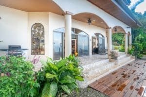Beautiful ocean view villa with covered patio and lush garden in Dominical.