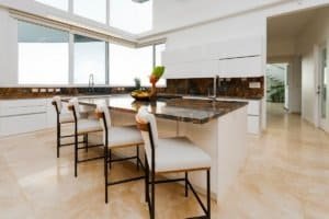 Bright kitchen with large windows and ocean view in Costa Rica.