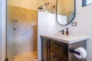 Contemporary bathroom with walk-in shower and modern fixtures in Dominical.