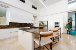 Bright, modern kitchen with white cabinets and island in Costa Rica.