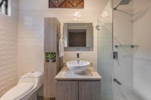 Contemporary bathroom with walk-in shower and vessel sink in Costa Rica.