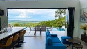 Modern living room with panoramic ocean and mountain view from Costa Rica.