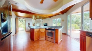 Bright kitchen with large windows and ocean view in Dominical.