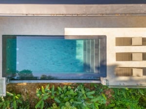Infinity pool with ocean view and tropical garden in Dominical.