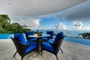 Outdoor dining area with ocean and jungle views in Dominical, Costa Rica.