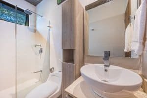 Contemporary bathroom with shower, toilet, and sink in Dominical property.