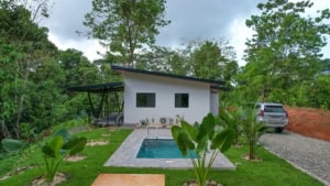 Contemporary house with pool and lush greenery in Dominical, Costa Rica.