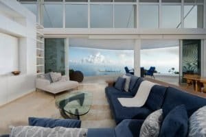 Modern living room with panoramic ocean views and stylish furniture in Dominical.