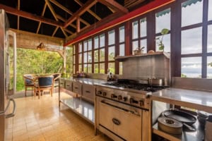 Spacious kitchen with ocean view and natural light in Dominical.