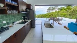 Modern kitchen with panoramic ocean and mountain views in Dominical.