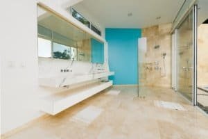 Bright modern bathroom with glass shower and ocean view in Dominical.