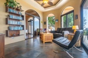 Bright living room with large windows and ocean view in Dominical.