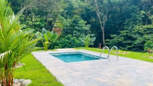 Beautiful pool with lush tropical garden in Dominical Costa Rica.
