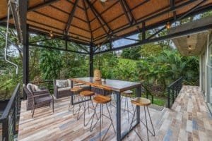 Outdoor patio with seating and lush greenery in Dominical, Costa Rica.