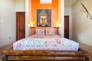 Cozy bedroom with colorful bedding and tropical decor in Costa Rica.