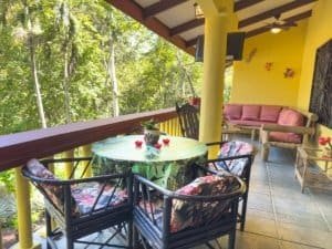 Balcony with seating and lush jungle view in Dominical Costa Rica.