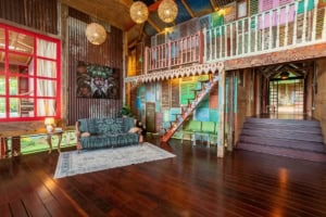 Vibrant, artistic interior with wooden accents and cozy seating in Dominical.