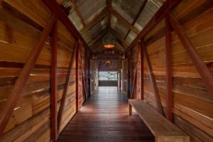 Wooden bridge with rustic design in Costa Rica rainforest.
