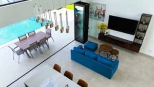 Modern living room with panoramic ocean and mountain views in Costa Rica.