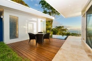 Contemporary outdoor deck with seating and ocean view in Dominical, Costa Rica.