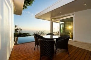 Modern outdoor deck with ocean views and dining area in Dominical.