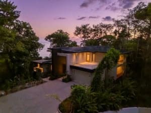 Modern ocean view home in Dominical with infinity pool and lush surroundings.