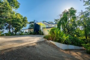 Modern tropical house with lush greenery and ocean view in Dominical.