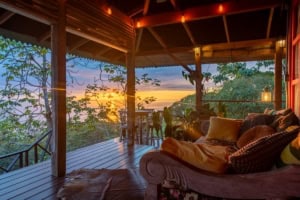 Cozy outdoor living space with ocean view and sunset in Dominical.