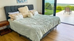 Bedroom with panoramic ocean and mountain views in Dominical, Costa Rica.