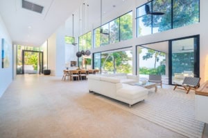 Spacious living room with large windows and ocean view in Costa Rica.