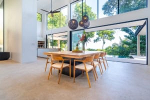 Spacious dining area with large windows and ocean view in Dominical, Costa Rica.