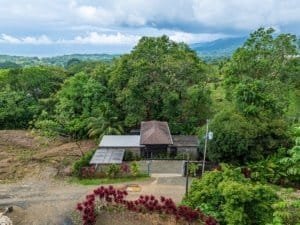 Scenic view of a house surrounded by lush green trees in Dominical, Costa Rica.