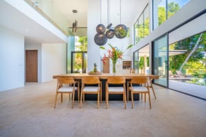 Bright, spacious dining room with large windows and contemporary decor.