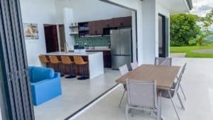 Open-concept kitchen and dining area with mountain view in Costa Rica.
