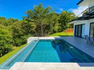 Panoramic ocean and mountain view from luxury Costa Rica home with pool.