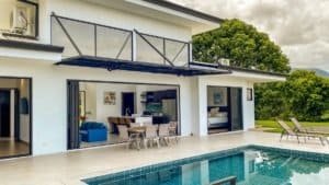 Modern Costa Rica home with pool, outdoor dining, and mountain views.