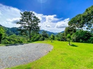 Scenic mountain view with lush greenery and blue sky in Costa Rica.