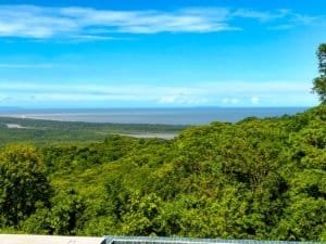 Stunning ocean and mountain view from a lush green landscape in Dominical, Costa Rica.